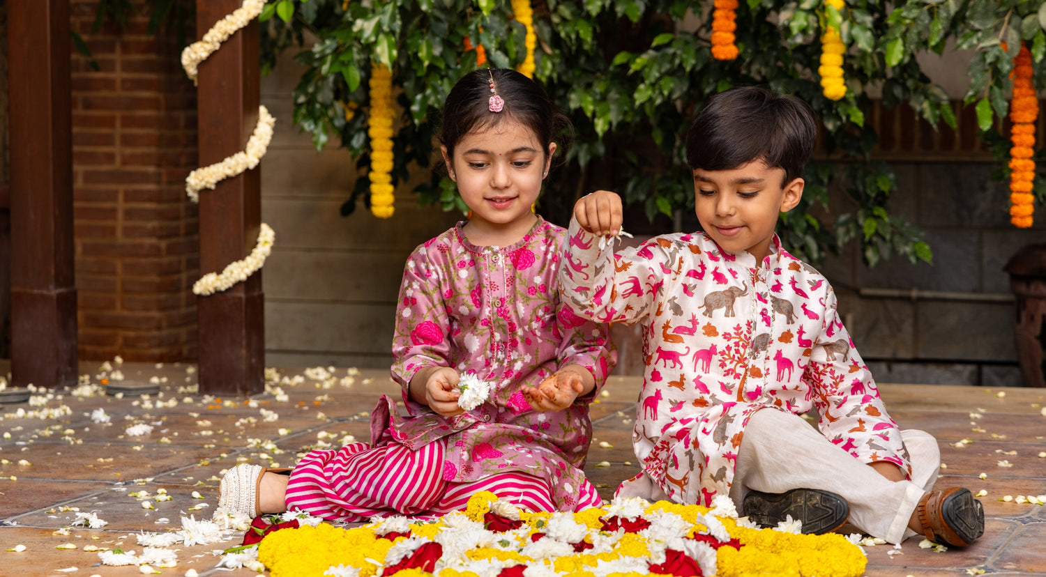 two kids wearing kurta pajama set during diwali festive