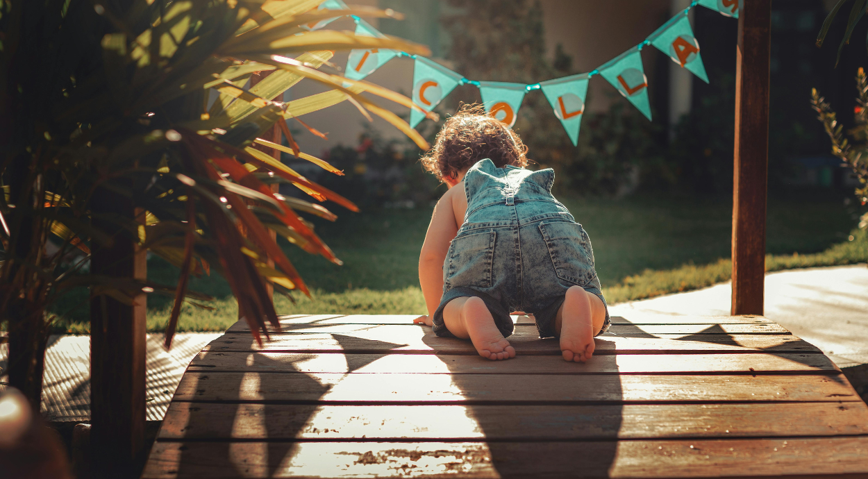 baby crawling in a garden