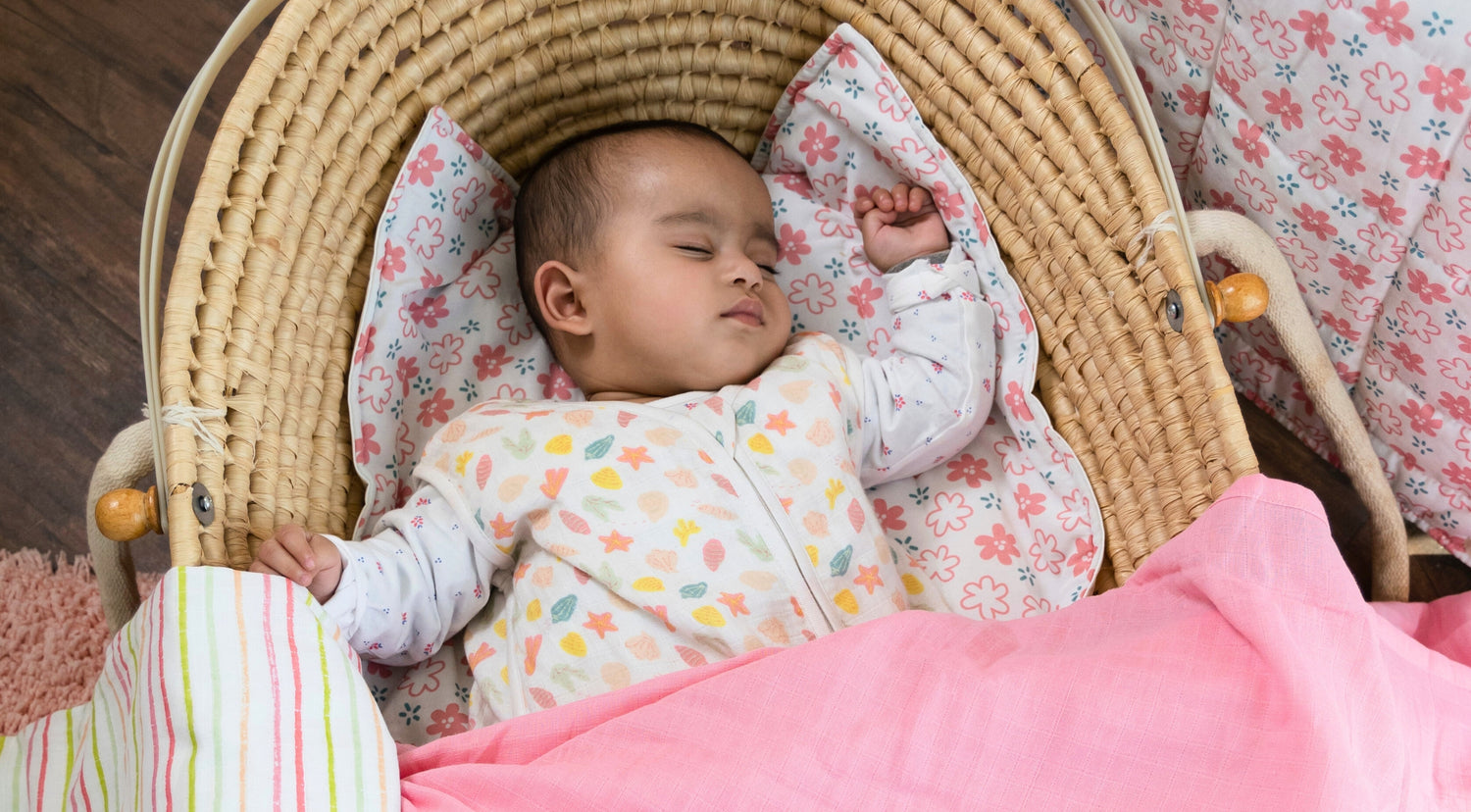 newborn baby sleeping in baby bedding set