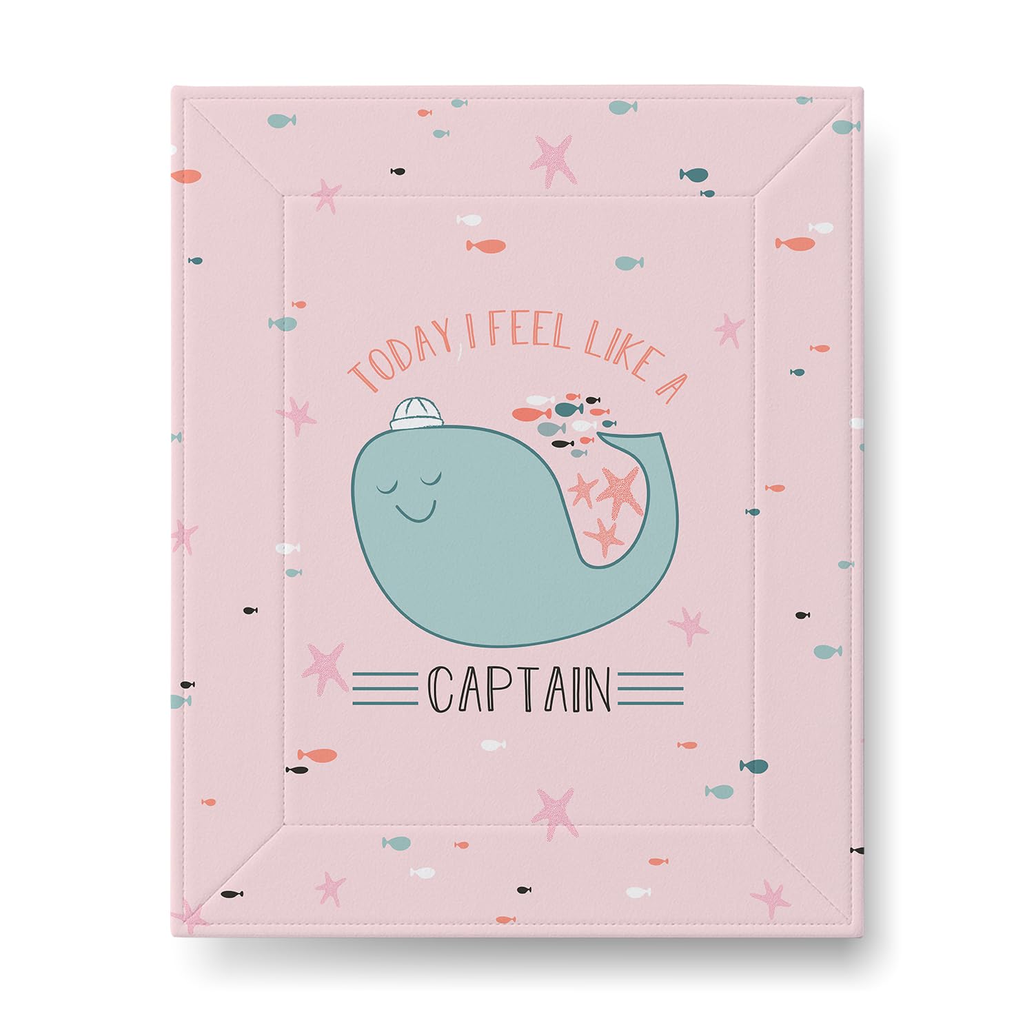 A pastel pink mat features a smiling whale wearing a sailor hat, surrounded by small fish and starfish. The text reads, "Today I feel like a captain."