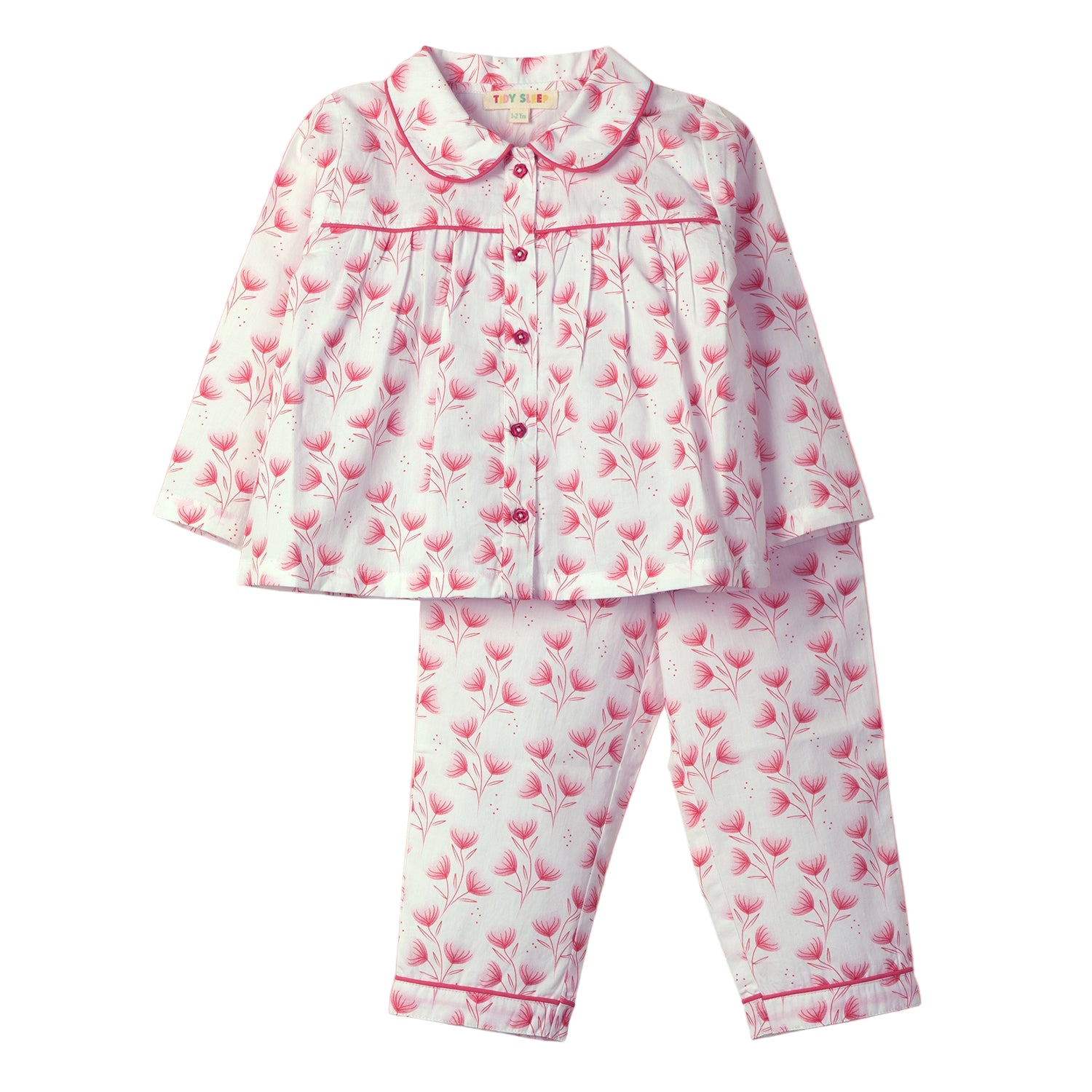 Floral-patterned baby night suit set featuring a button-up top and matching pants, against a pink background.
