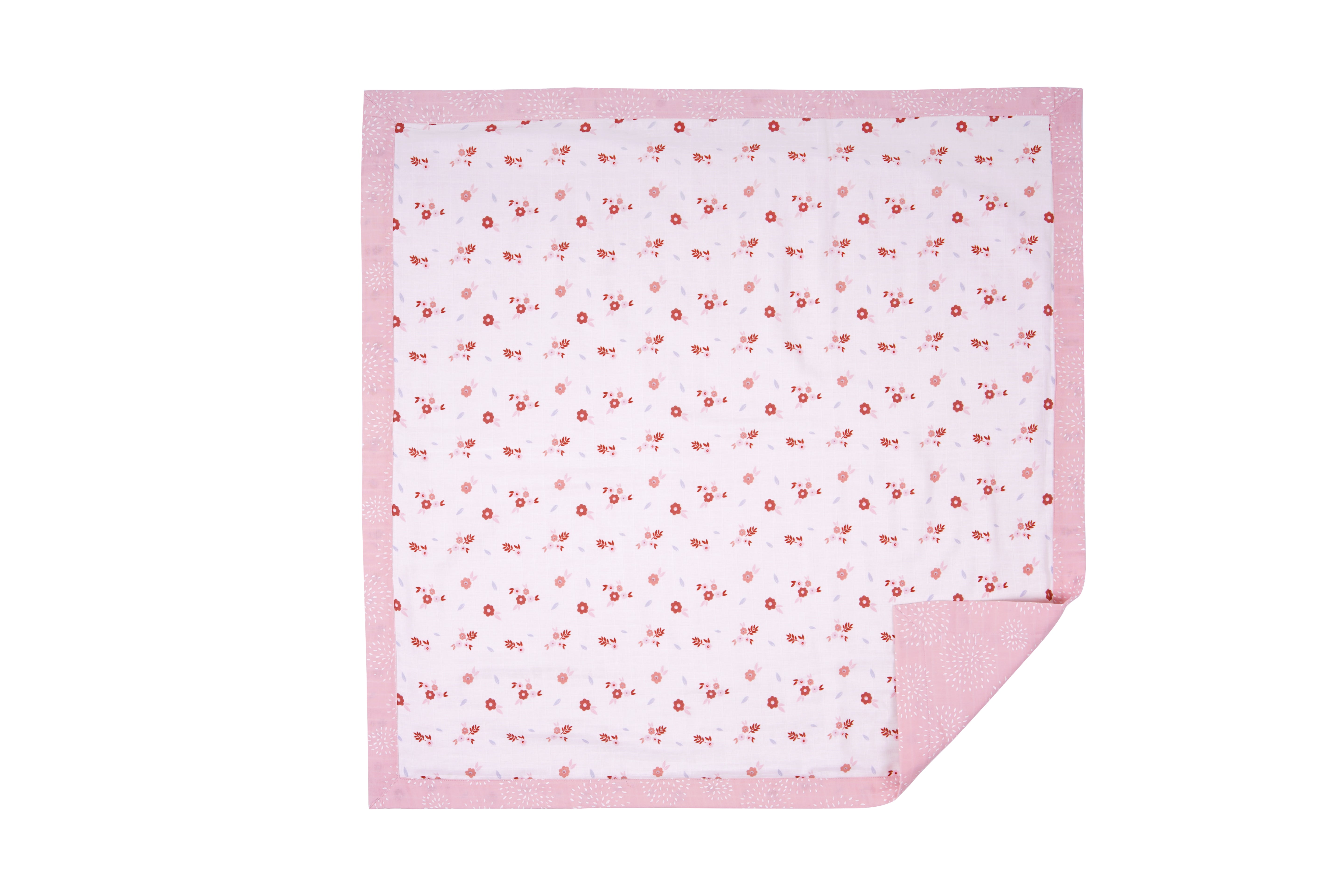 A soft quilt featuring a delicate floral pattern in red and pink hues on a light background with a coordinating pink border.