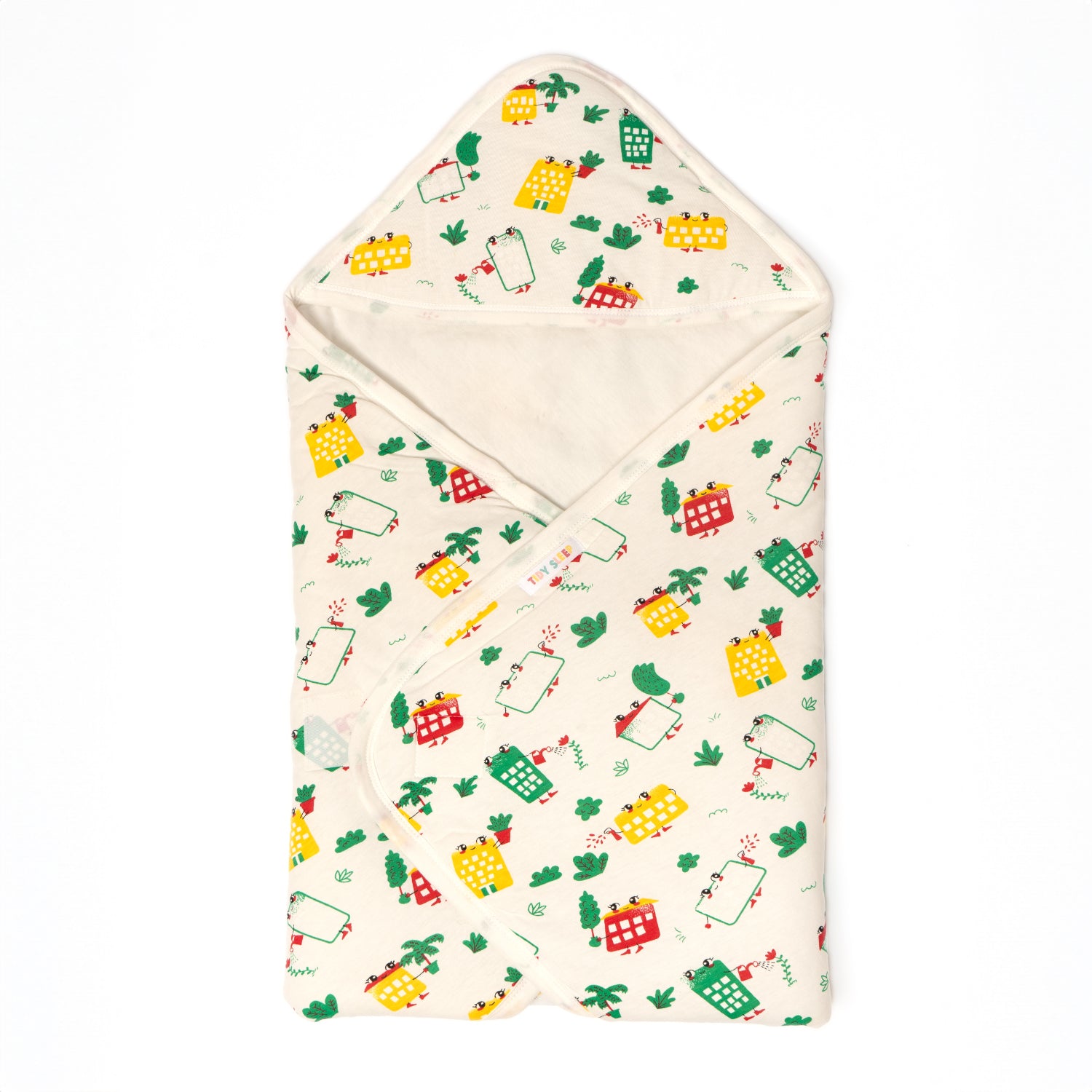 A cozy baby blanket featuring a playful design of colorful houses and greenery.
