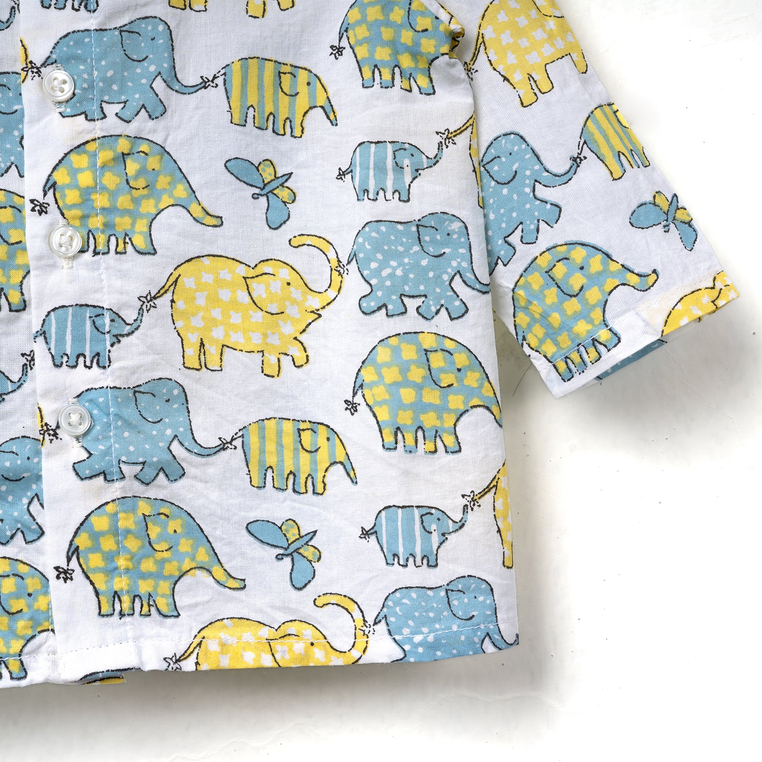 Right side closeup view of a colorful baby shirt jhabla set featuring playful elephants in blue and yellow patterns on a light background.