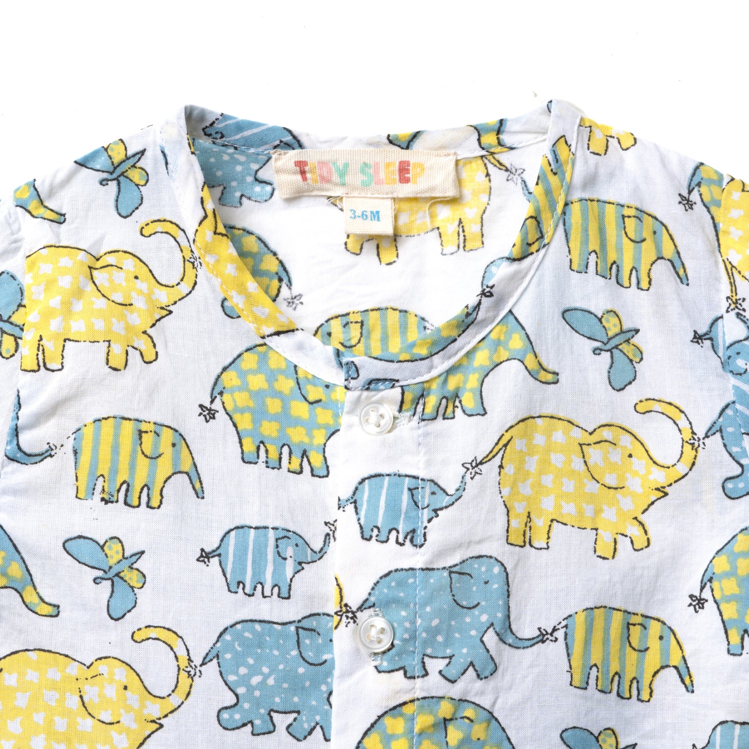 Upper side closeup view of a colorful baby shirt jhabla set featuring playful elephants in blue and yellow patterns on a light background.