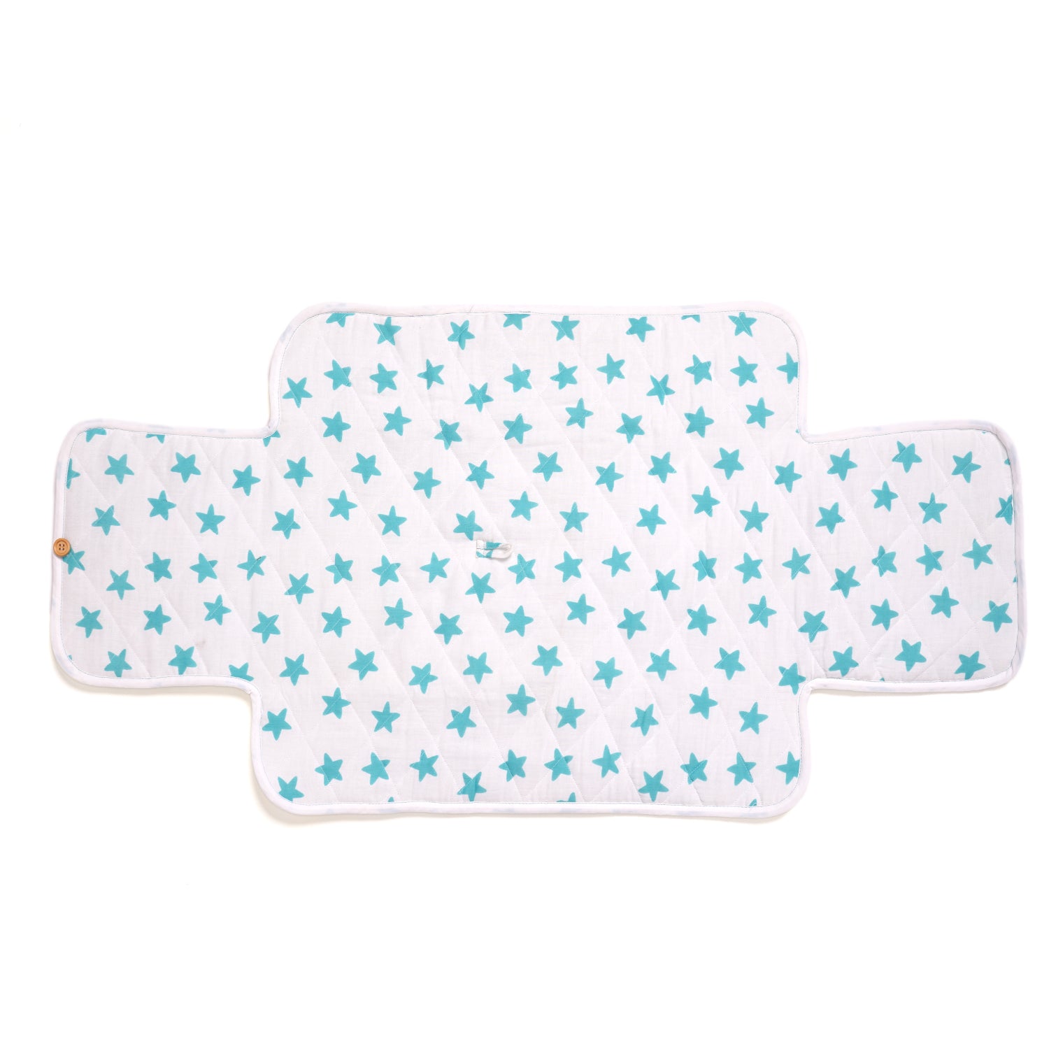 A white changing pad with a pattern of blue stars.