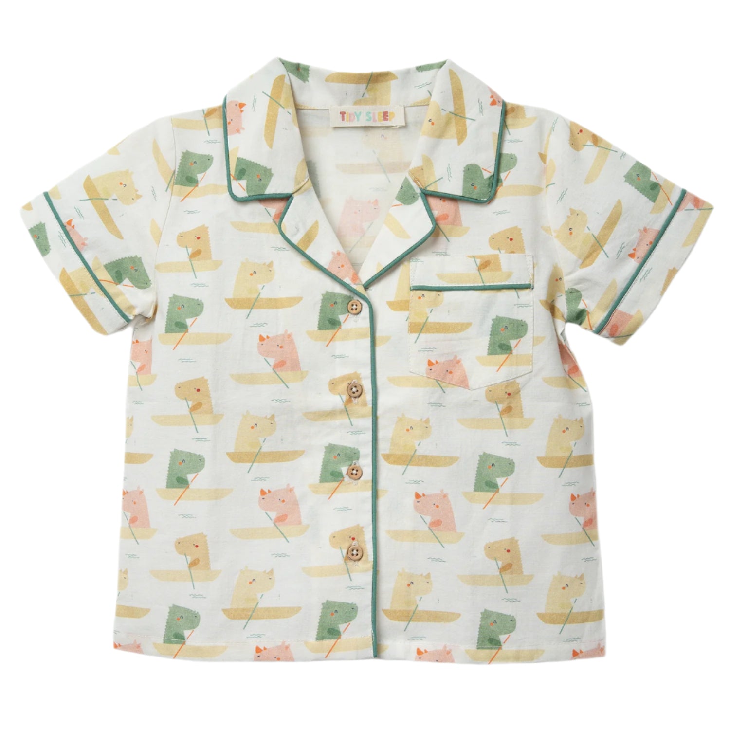 A light-colored baby shirt featuring a playful print of animals in boats, bordered with green piping and wooden buttons.