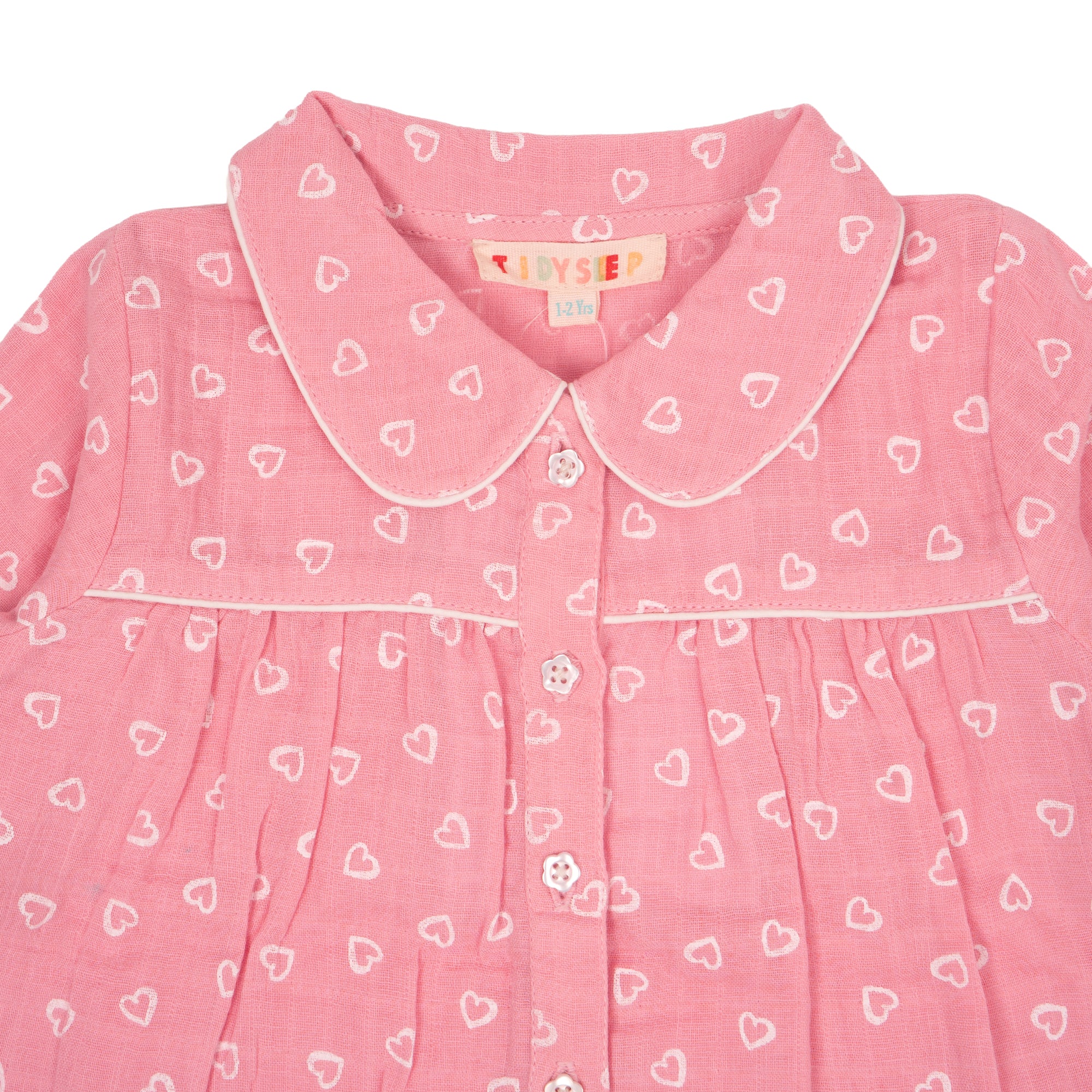 Closeup of pink night suit with mini hearts