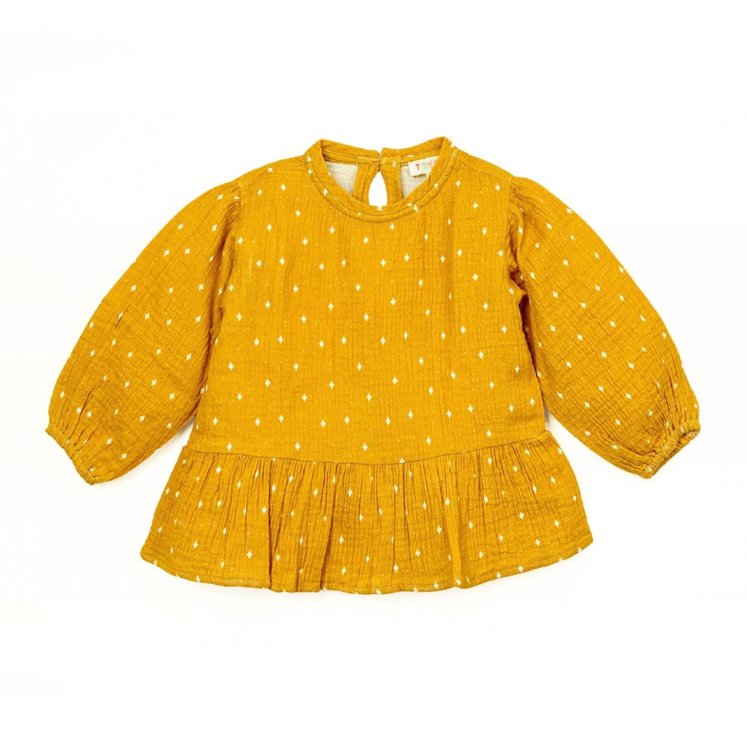 A mustard yellow baby girls’ top featuring long puffed sleeves, a round neckline, and white polka dots with a gathered peplum hem.