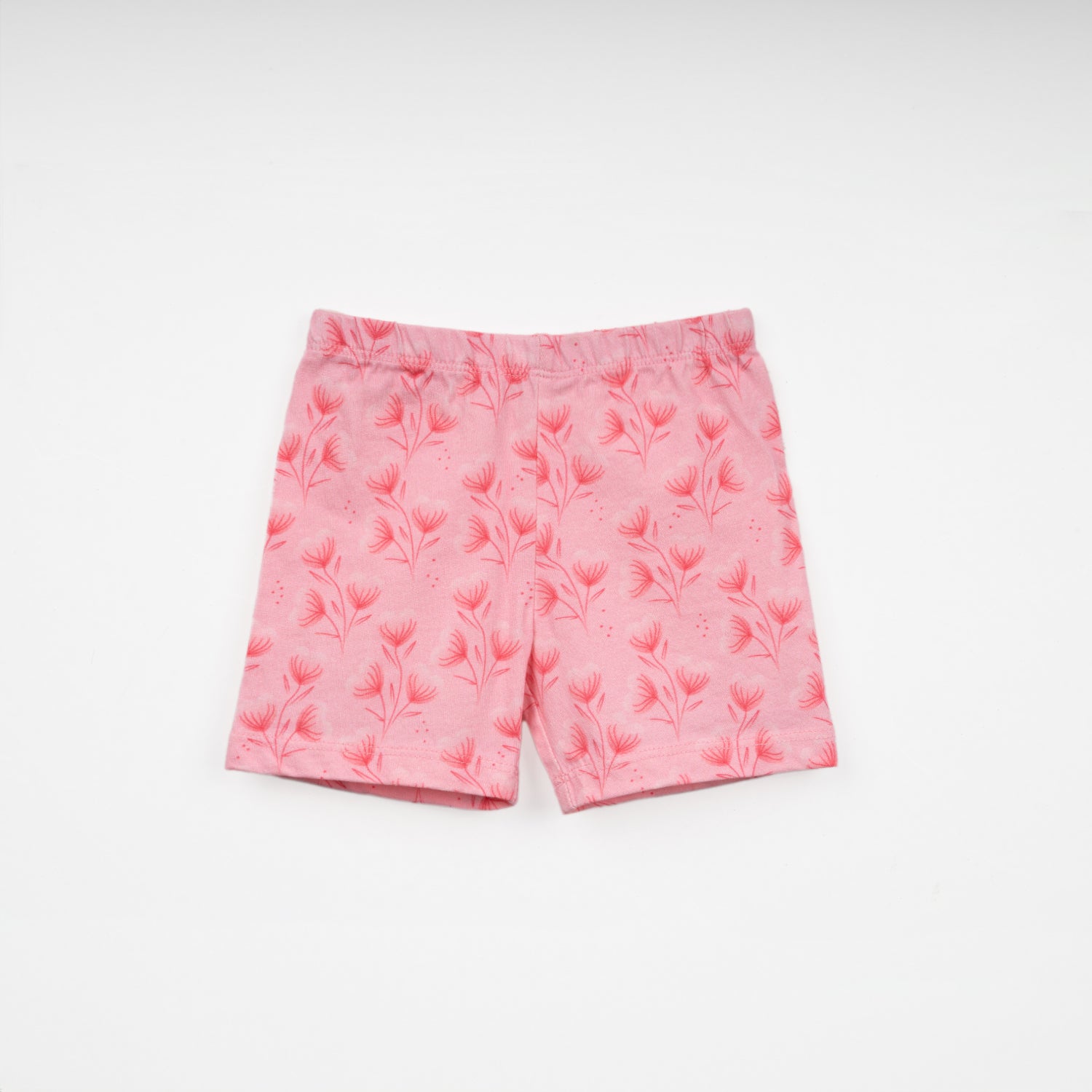 Baby pink shorts featuring a delicate floral pattern, displayed flat against a white background.