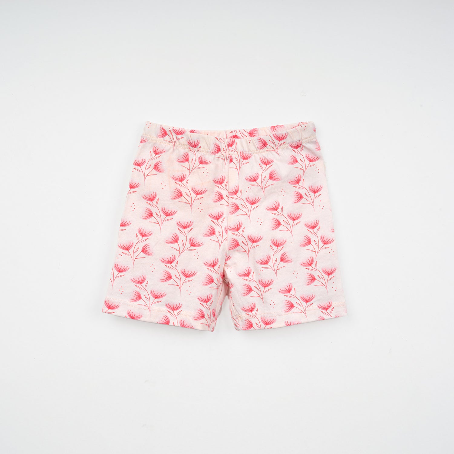 Light pink shorts for baby with a floral pattern featuring sprigs and blossoms in shades of pink, set against a simple background.