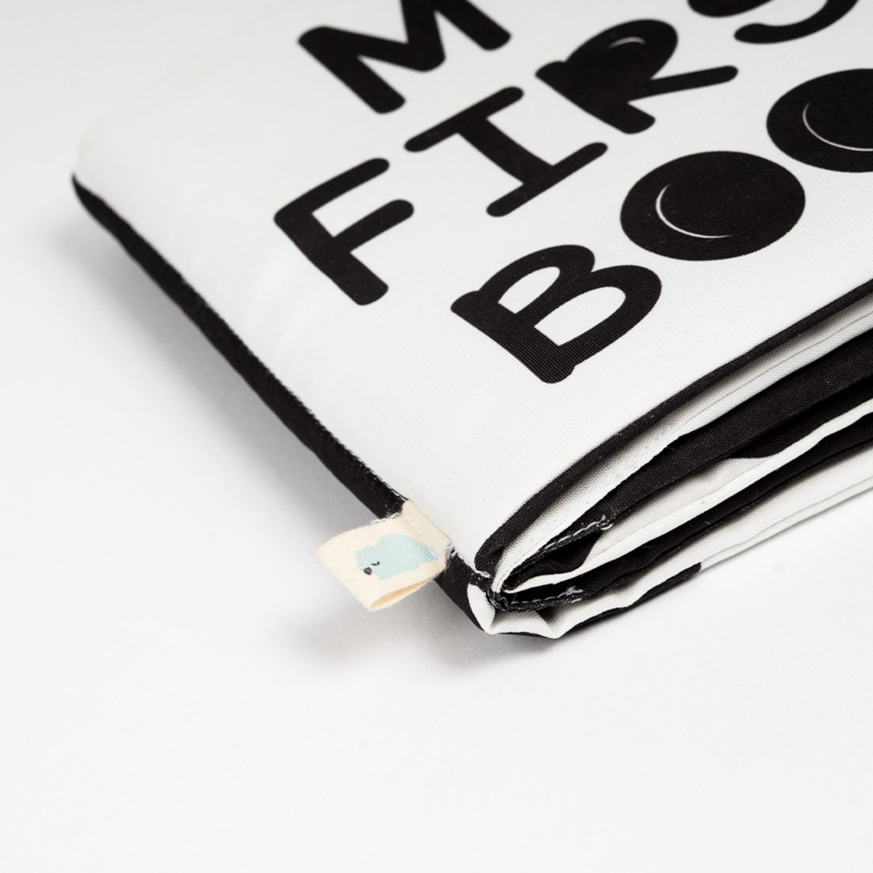 Closeup view of a white and black cloth high contrast book for baby