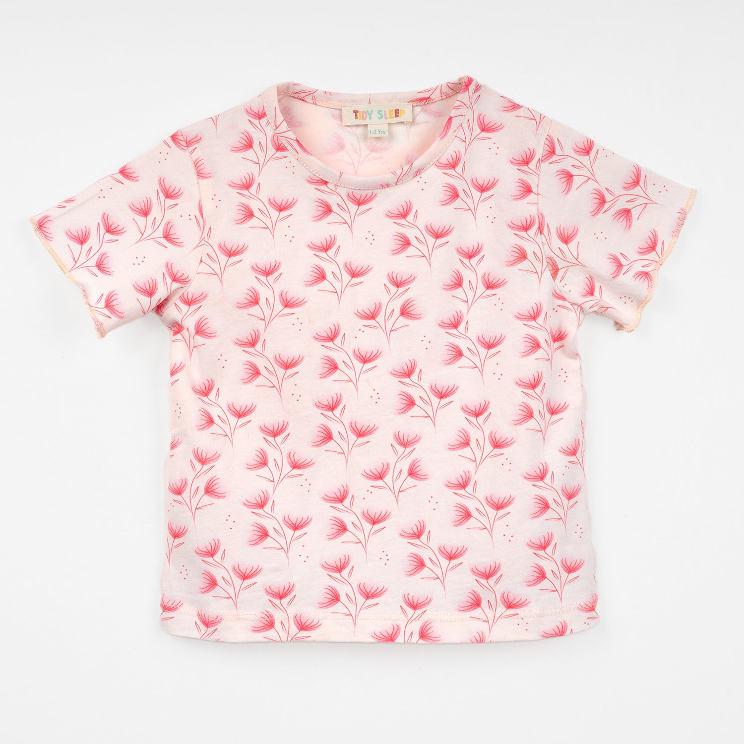 Light pink short-sleeve top for baby featuring a delicate floral pattern in shades of red.