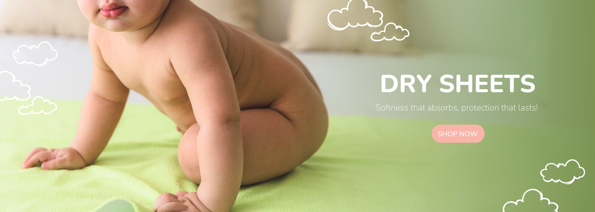 a baby sitting in green dry sheet, with a  white backdrop and playful design elements.
