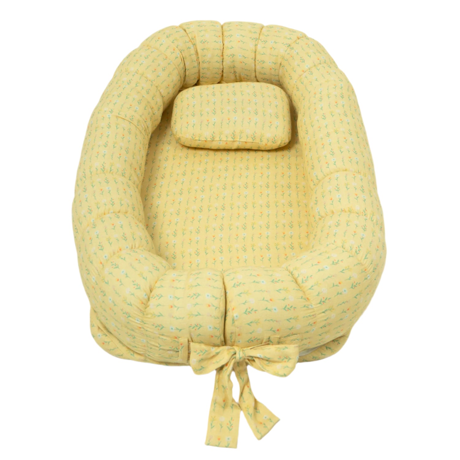 A yellow-colored baby lounger with a soft, quilted pattern, featuring a padded oval shape and an attached pillow.