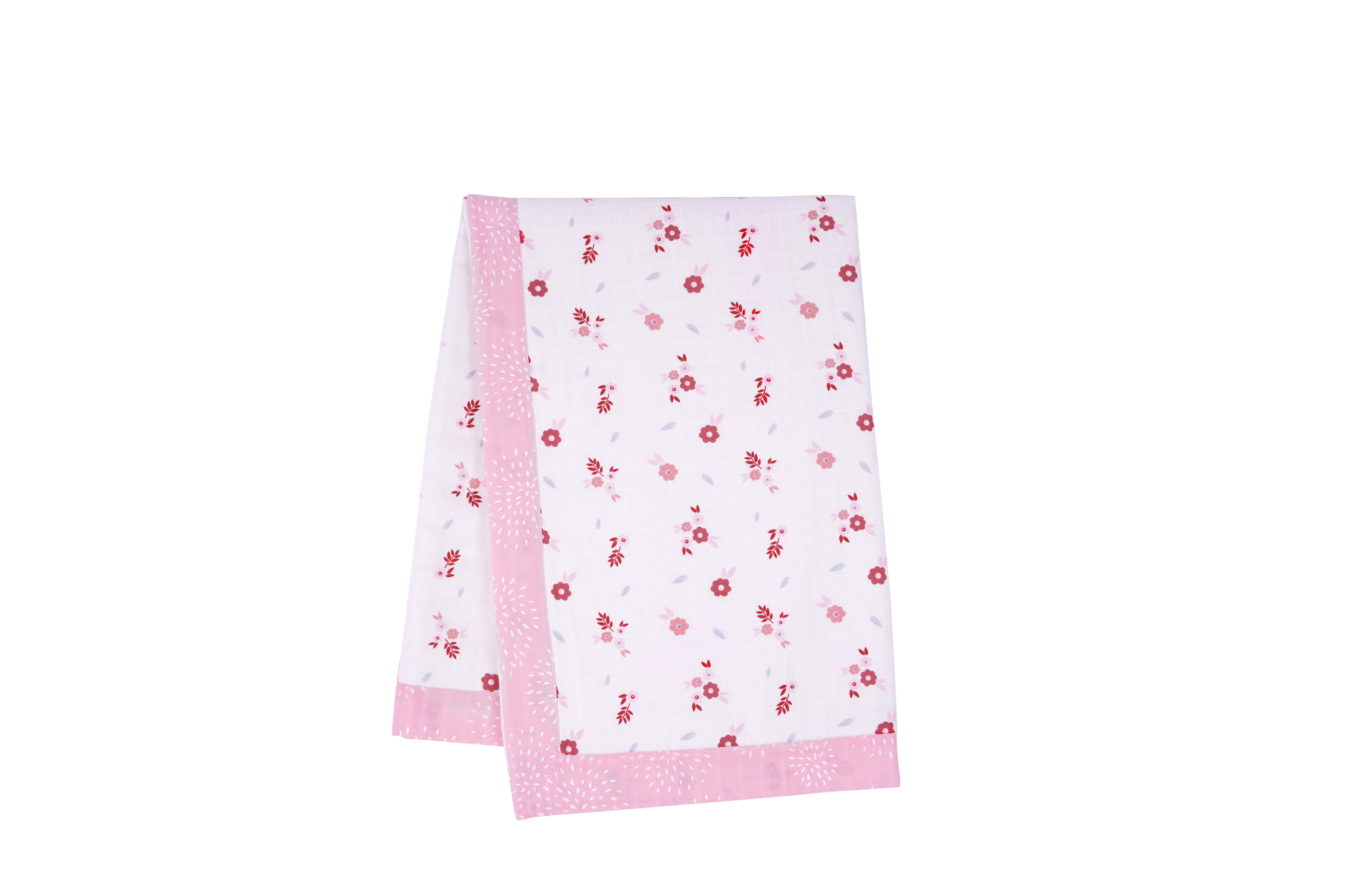 Floral-patterned fabric napkin with a pink border, featuring small red and pink flowers on a light background.