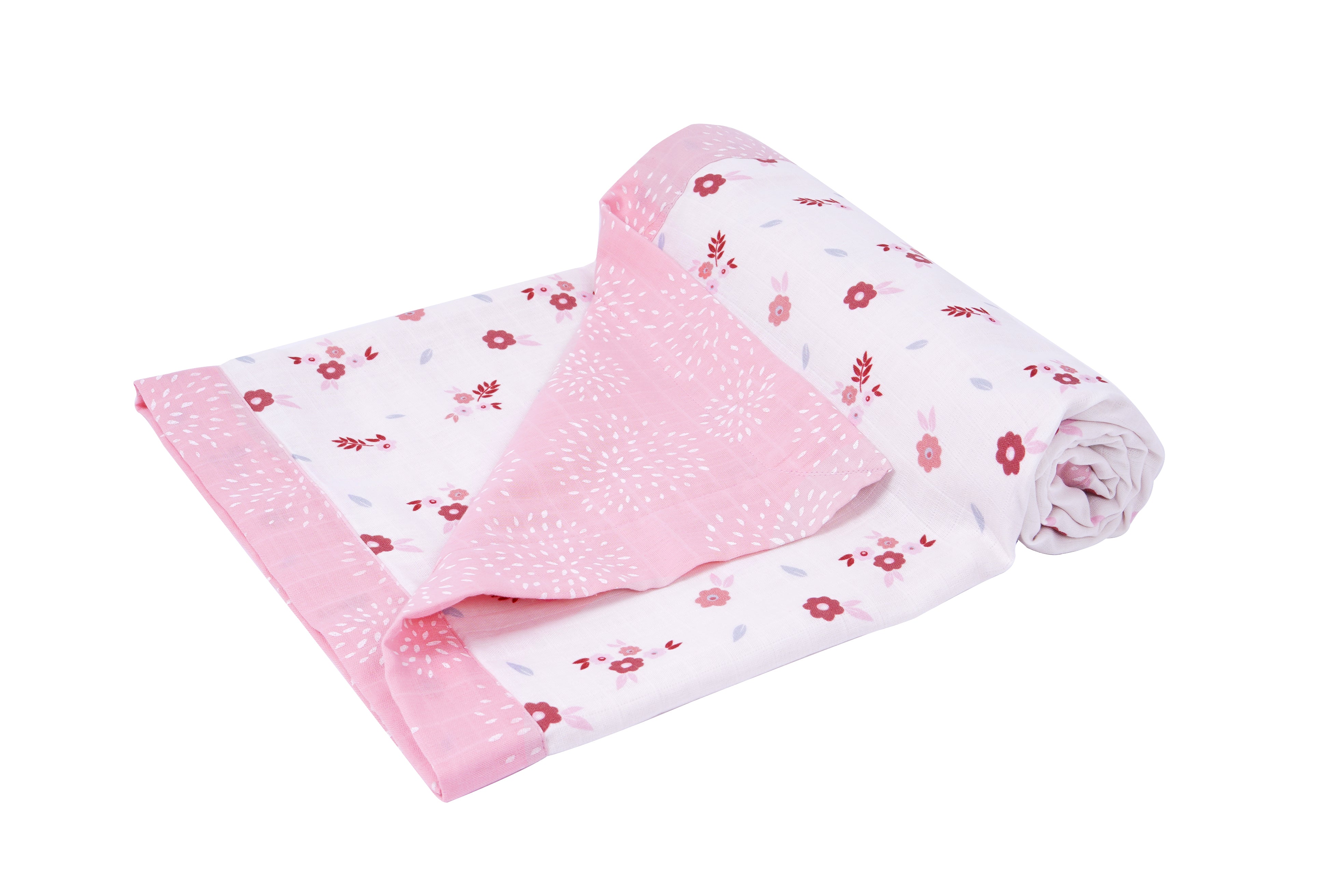 A folded pink and white blanket featuring floral patterns and subtle bunny designs, perfect for cozying up.