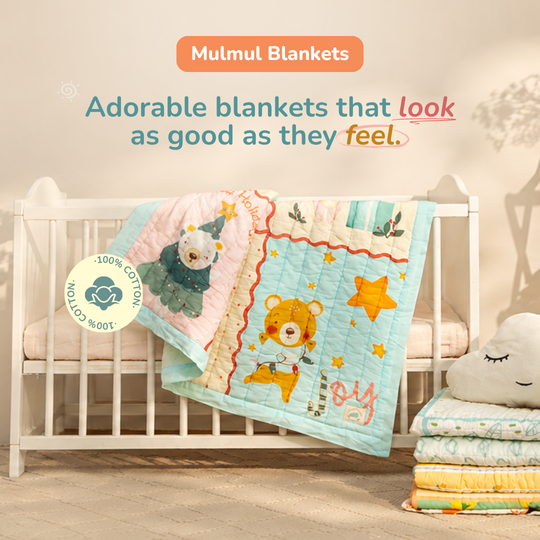 A pastel quilted baby blanket with embroidered teddy bear and star designs draped over a white crib in a softly styled nursery. Text at the top reads 'Mummul Blankets' and 'Adorable blankets that look as good as they feel.