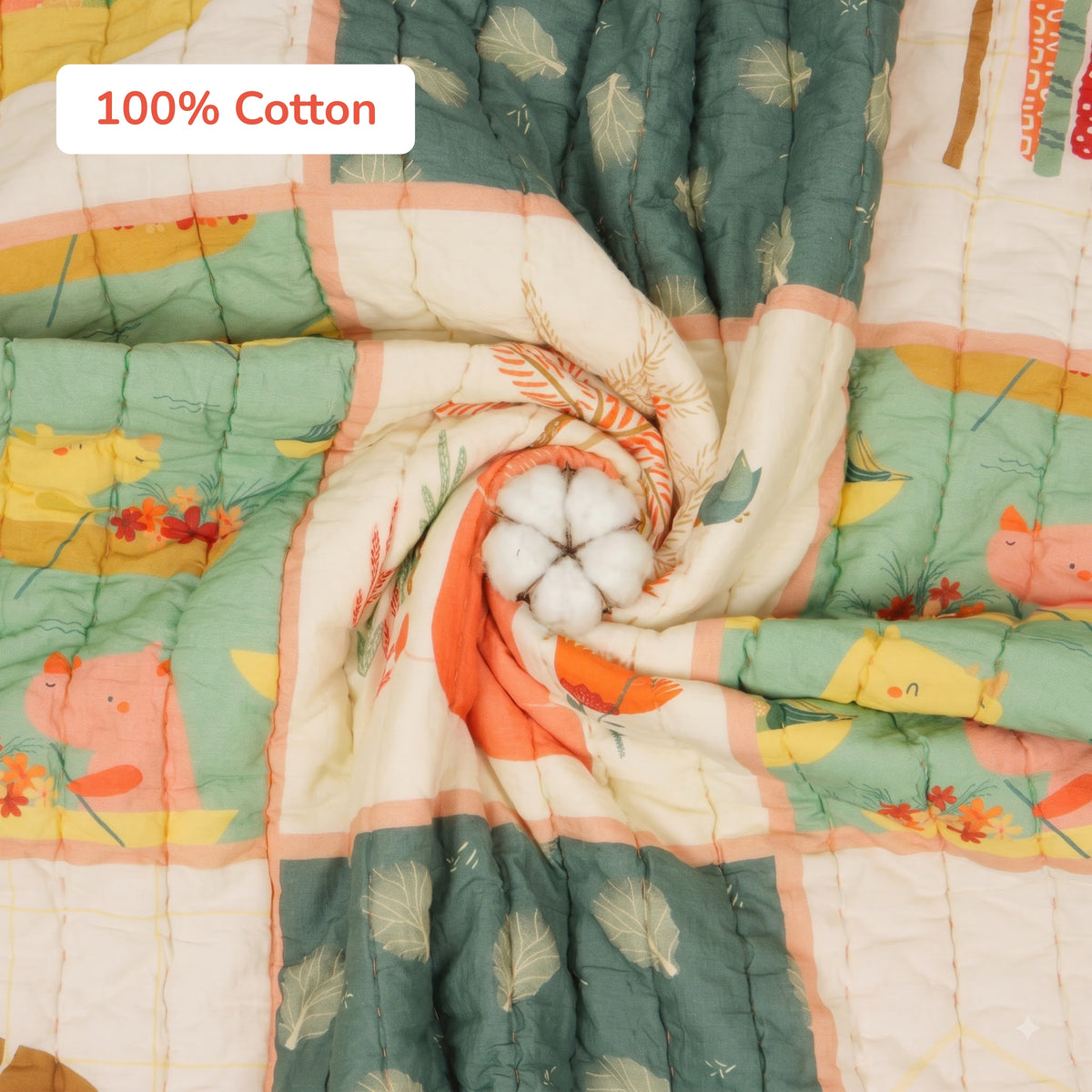 A quilted patchwork mulmul cotton blanket with a central cotton boll prop, featuring a '100% Cotton' label overlay, shown in a styled flat-lay arrangement.