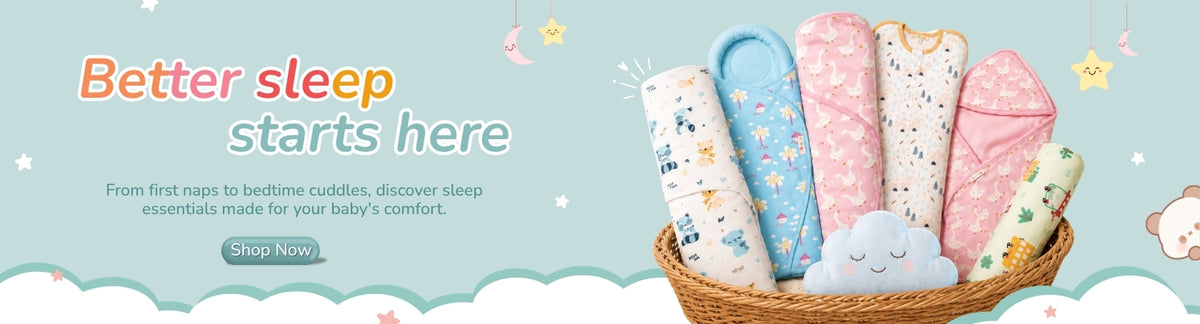 A promotional banner for baby sleepwear or bedding, showing a basket filled with pastel patterned baby blankets and swaddle-style pieces. Large text reads 'Better sleep starts here' with smaller descriptive copy on a light blue background with cloud and star illustrations.