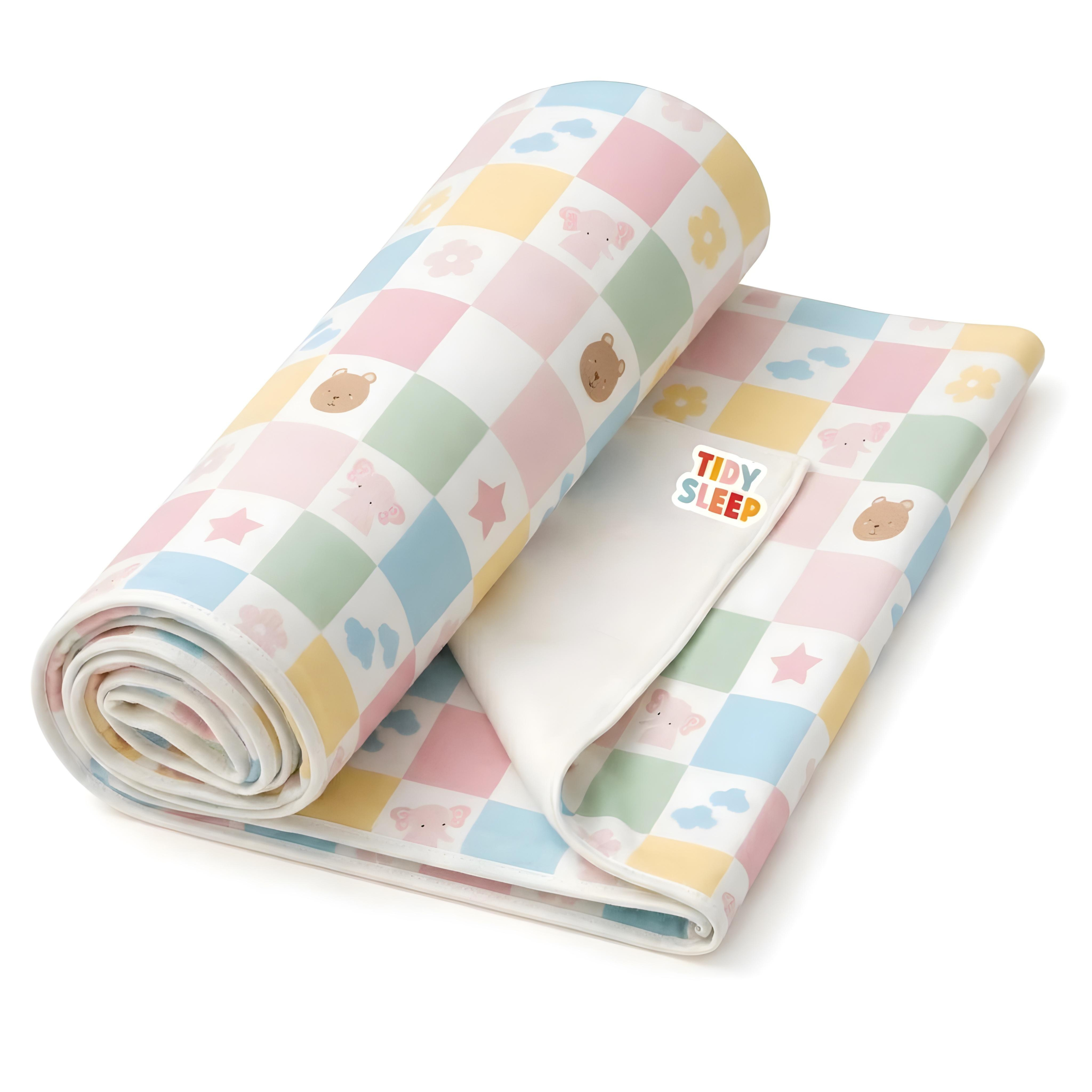 Roll of colorful baby dry sheet with cartoon designs on a white background