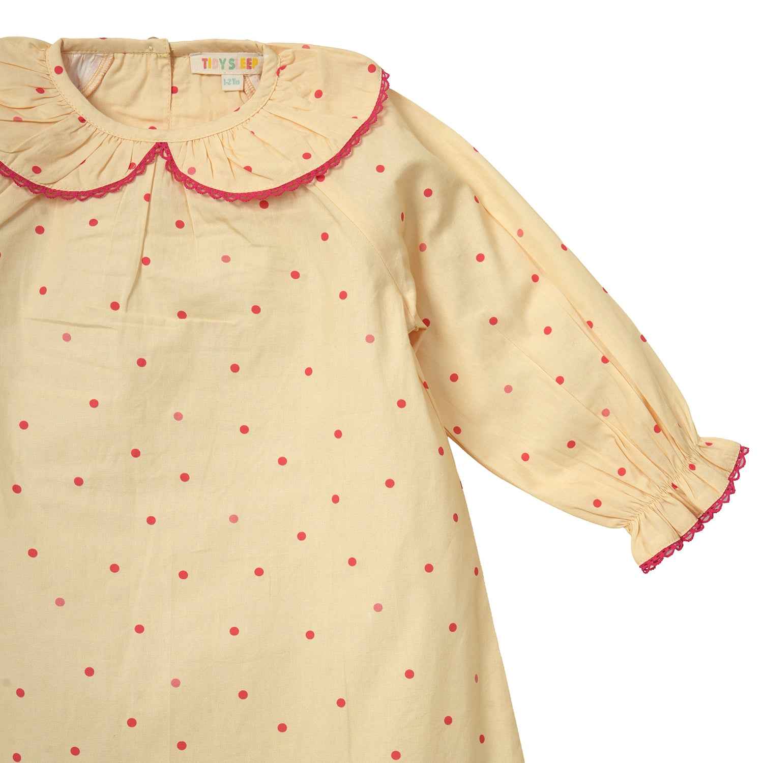 Closeup of a yellow Polka Dots Cotton Night Dress for baby girl
