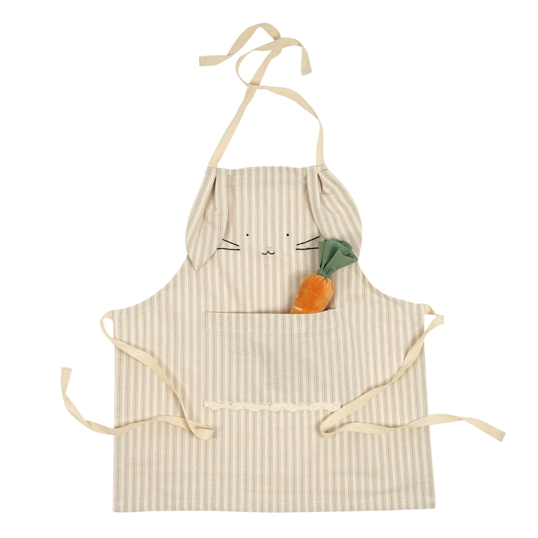 Ecru white striped children's apron resembling a rabbit, with a carrot pocket detail and bunny ears, perfect for playful cooking.